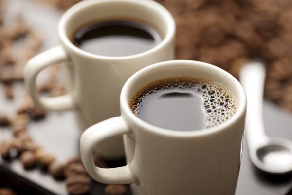 coffee cup filled with coffee beans